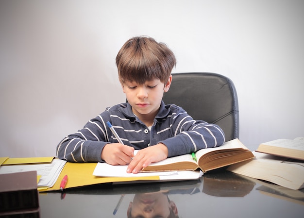 little boy studying 