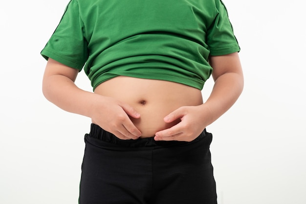 Photo little boy suffering from stomach ache, isolated on white