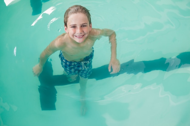 Little boy swimming in the pool