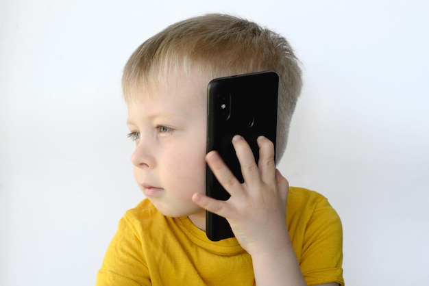 little boy uses a smart phone