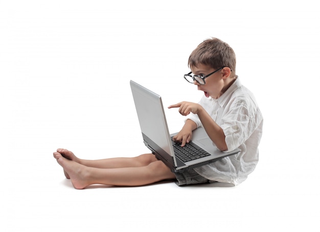 Little boy using a laptop