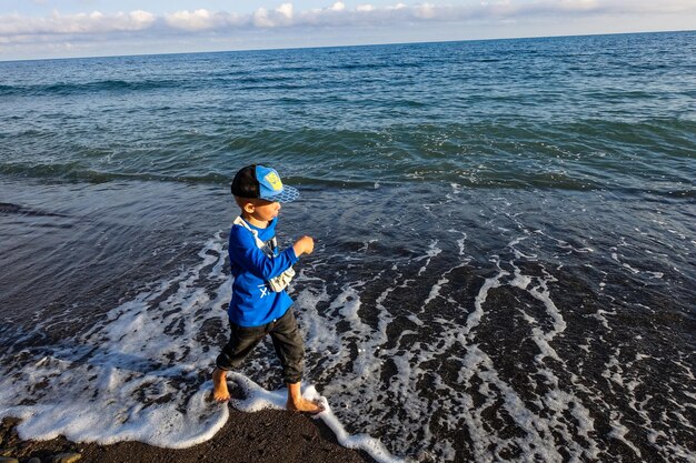 A little boy in Veselovskaya Bay Crimean Riviera near Sudak Crimea Russia 2021