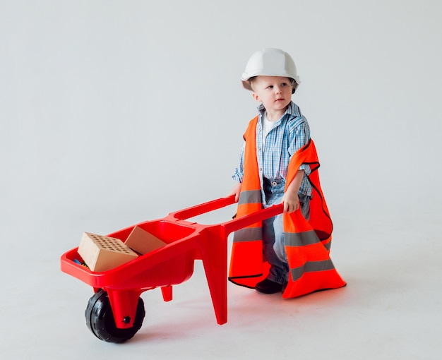 Little boy on the white background. Construction