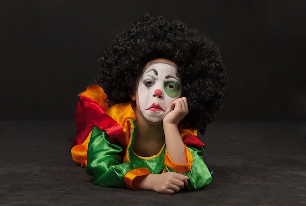 little boy with clown make-up