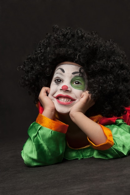 little boy with clown make-up