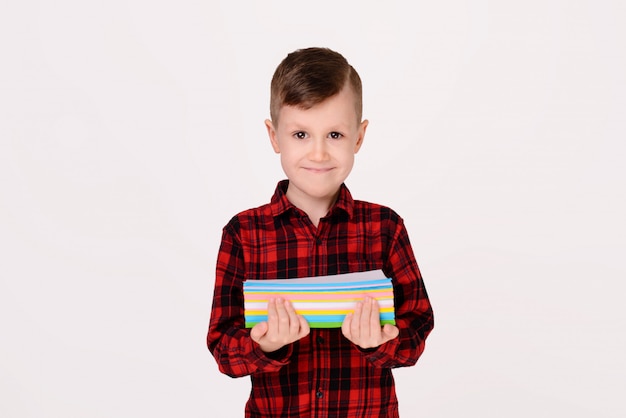 The little boy with expressive emotion on a white background. 