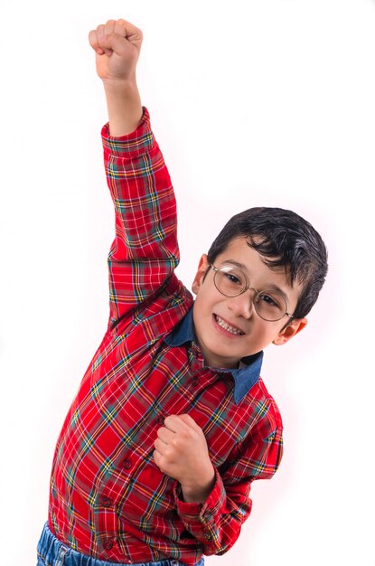 Little boy with eyeglasses raised his fists up