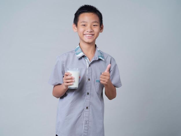 Little boy with glass of milk