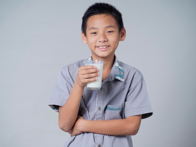 Little boy with glass of milk