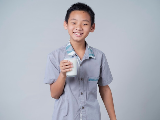 Little boy with glass of milk