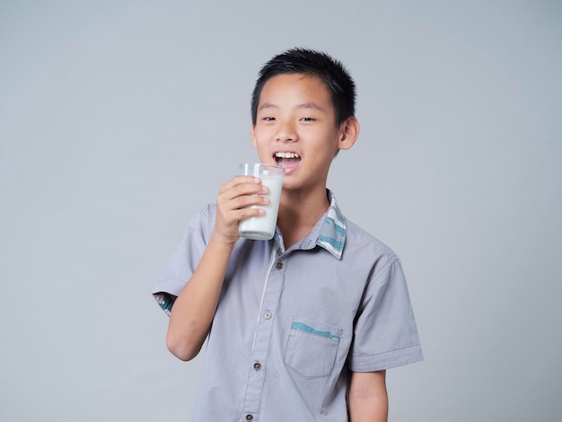 Little boy with glass of milk