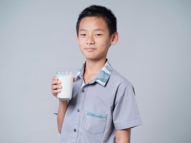 Little boy with glass of milk