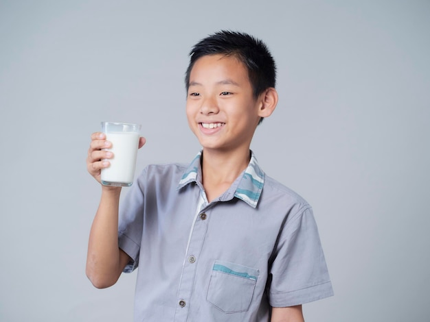Little boy with glass of milk