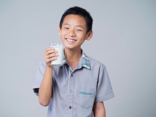 Little boy with glass of milk