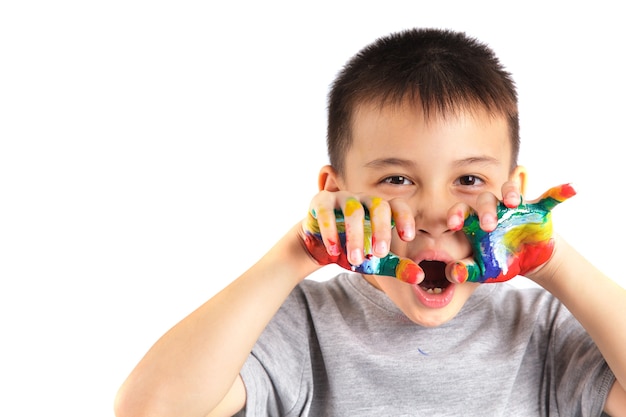 Little boy with hands painted in colorful paint