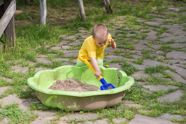 A little boy with sand