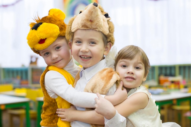 Little boys and girls in carnival costumes