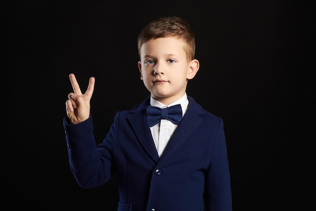 Little boystylish kid in suit