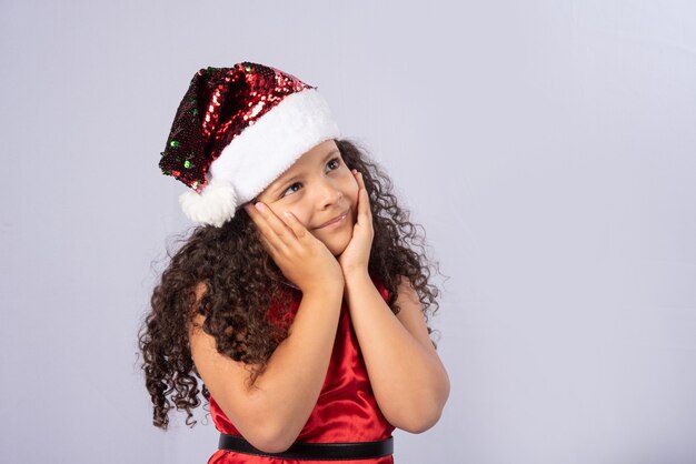 little Brazilian girl dressed with christmas costume