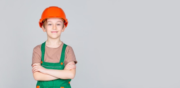 Little builder in helmet Child dressed as a workman builder Little boy wearing helmet Portrait little builder in hardhats Child building helmet hard hat