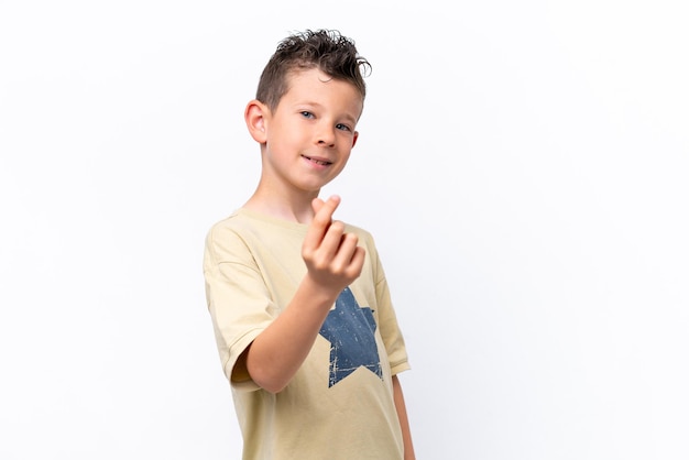 Little caucasian boy isolated on white background making money gesture