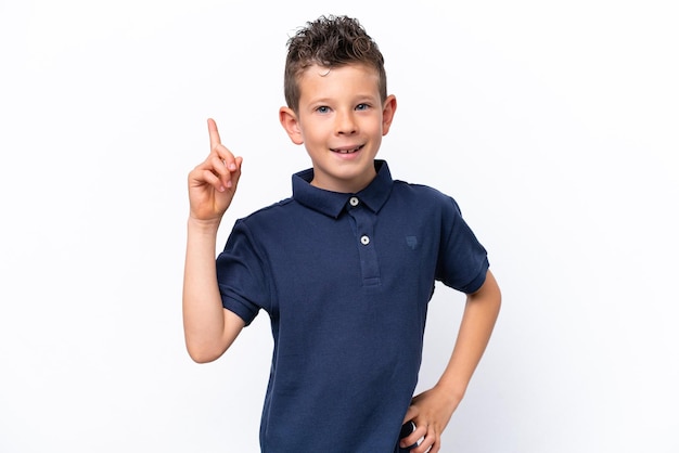 Little caucasian boy isolated on white background showing and lifting a finger in sign of the best