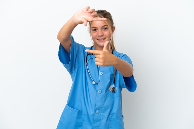 Little caucasian girl disguised as surgeon isolated on white background focusing face Framing symbol