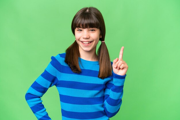 Little caucasian girl over isolated background showing and lifting a finger in sign of the best