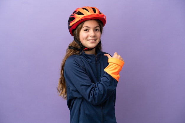 Little caucasian girl isolated on purple background proud and self-satisfied