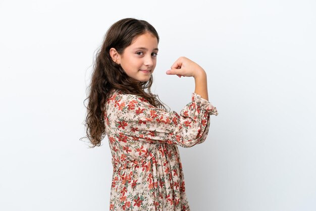 Little caucasian girl isolated on white background doing strong gesture