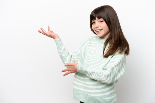 Little caucasian girl isolated on white background extending hands to the side for inviting to come