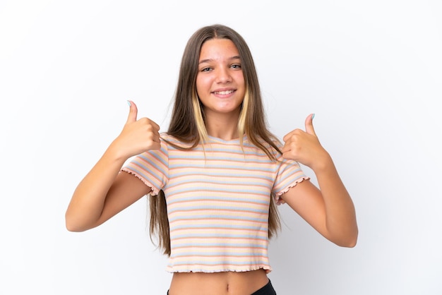 Little caucasian girl isolated on white background giving a thumbs up gesture