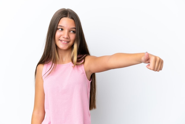 Little caucasian girl isolated on white background giving a thumbs up gesture