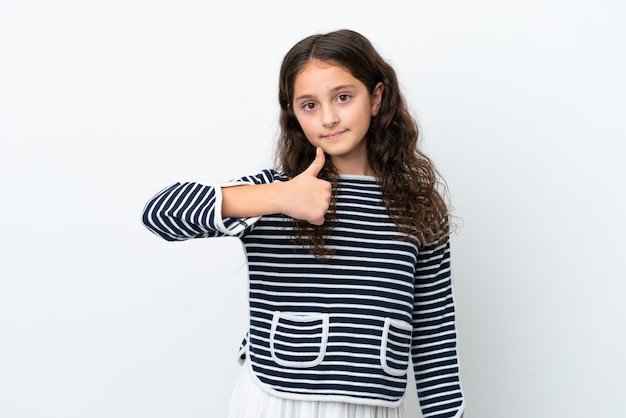 Little caucasian girl isolated on white background giving a thumbs up gesture