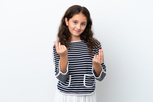 Little caucasian girl isolated on white background making money gesture