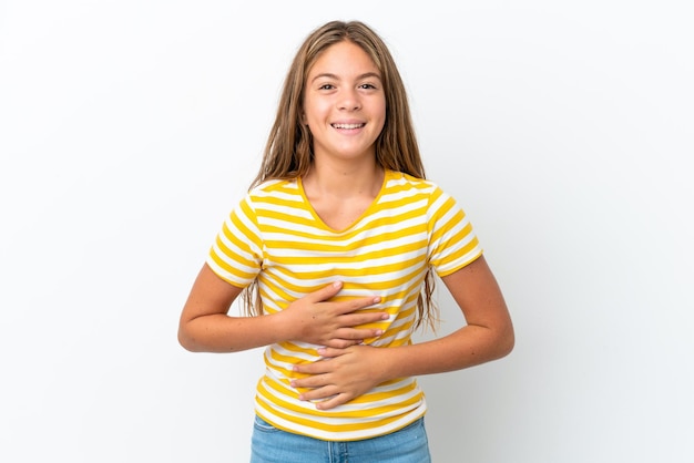 Little caucasian girl isolated on white background smiling a lot