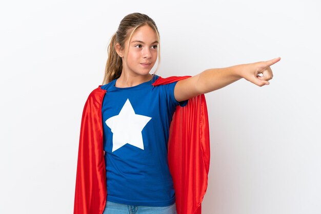 Little caucasian girl isolated on white background in superhero costume with proud gesture