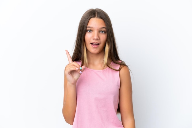 Little caucasian girl isolated on white background thinking an idea pointing the finger up