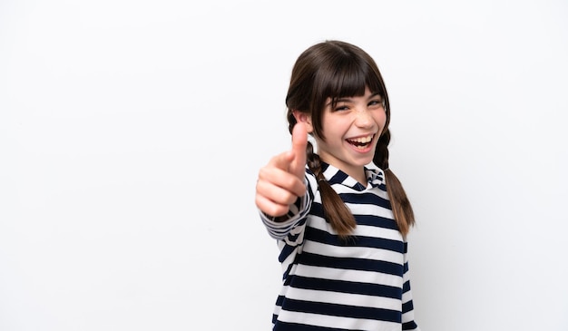 Little caucasian girl isolated on white background with thumbs up because something good has happened