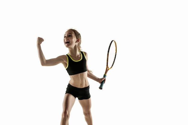 Little caucasian girl playing tennis isolated on white wall