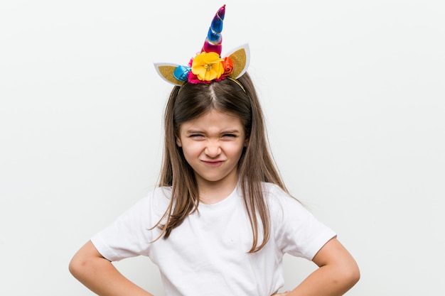 Little caucasian girl with costume and accessories having fun