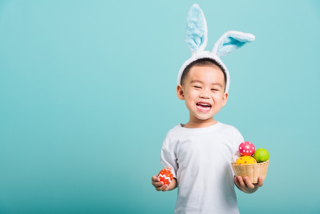 Little child boy wearing bunny ears and white T-shirt