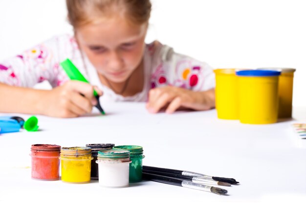 Photo little child drawing on a white background