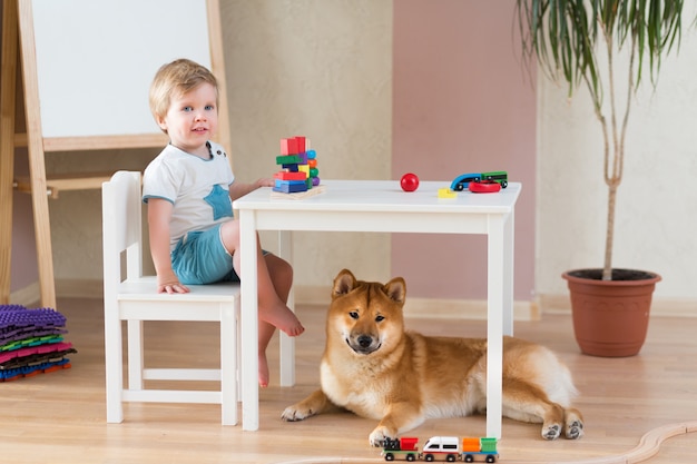 Little child girl and small cute dog