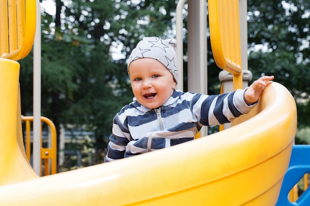 Little child having fun on playground outdoors