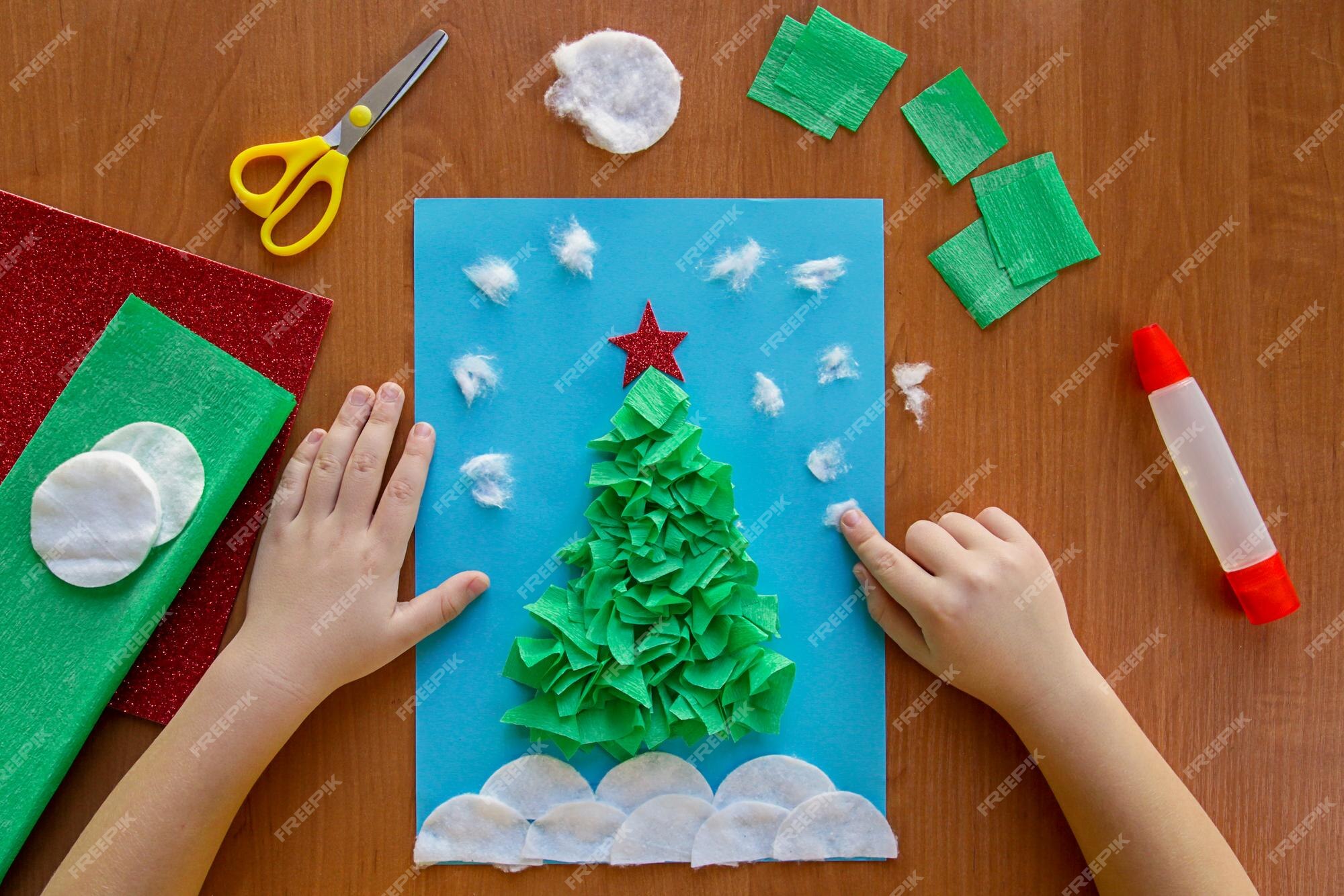 Premium Photo | Little child making winter decoration christmas ...
