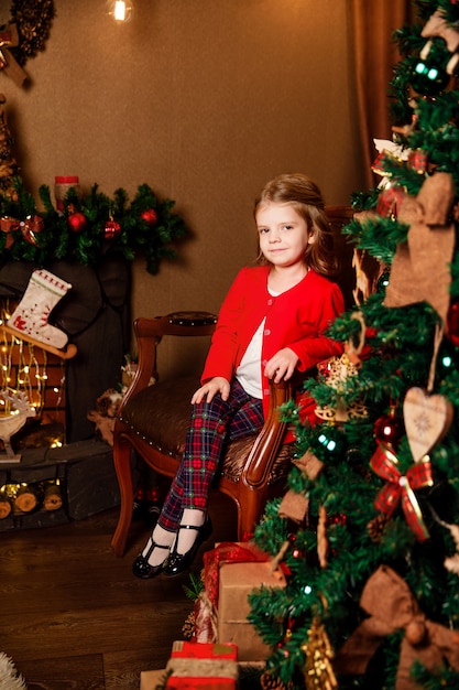 Little child near Christmas tree