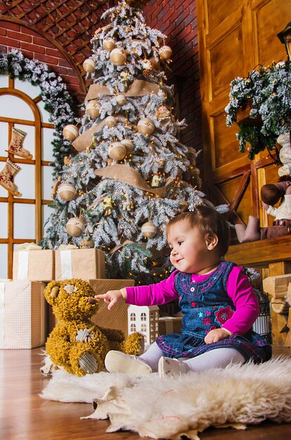 little child playing with toys at christmas