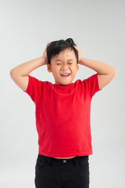 Little child in red t-shirt screaming