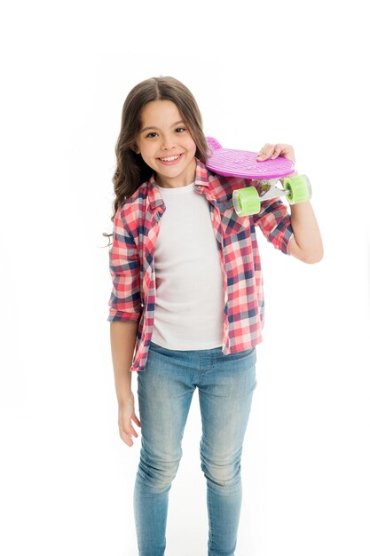 Little child smile with penny board isolated on white. Happy skater girl. Ready to ride. Hipster child is active in summer. Skateboarding is way of life. Active hobby and sport activity.